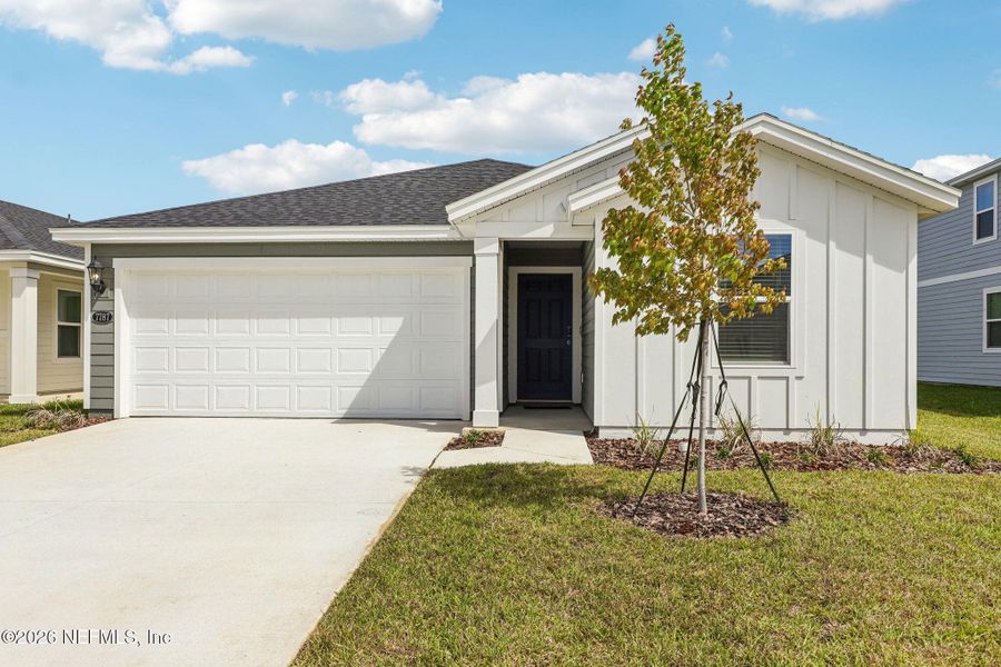 Front exterior of a new home in Kings Preserve, Jacksonville, FL, highlighting curb appeal (Image 19).