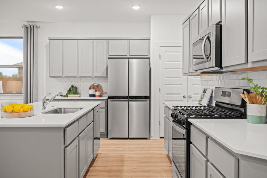 Kitchen in the Oak home plan by Trophy Signature Homes – REPRESENTATIVE PHOTO Kitchen in the Oak home plan by Trophy Signature Homes – REPRESENTATIVE PHOTO