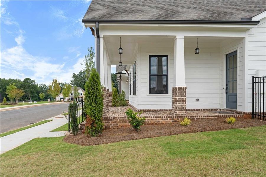 Front exterior of a new home in Promenade at Sawnee Village, Cumming, GA, highlighting curb appeal (Image 21).