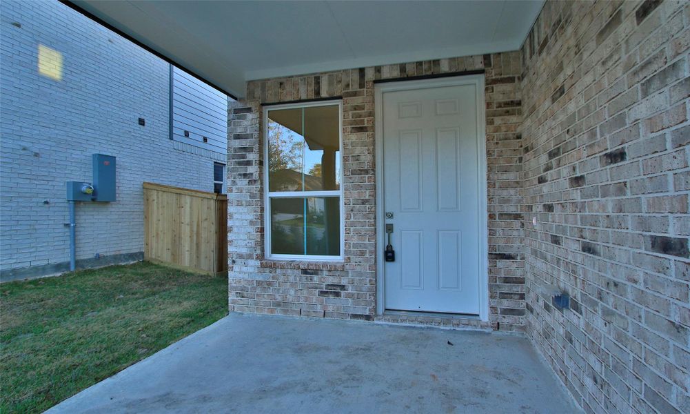 Exterior details and patio area of a home in The Woodlands Hills, Willis (Image 2).