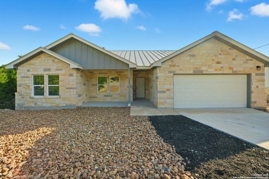 Front exterior of a new home in , Lakehills, TX, highlighting curb appeal (Image 1). Front exterior of a new home in , Lakehills, TX, highlighting curb appeal (Image 1).
