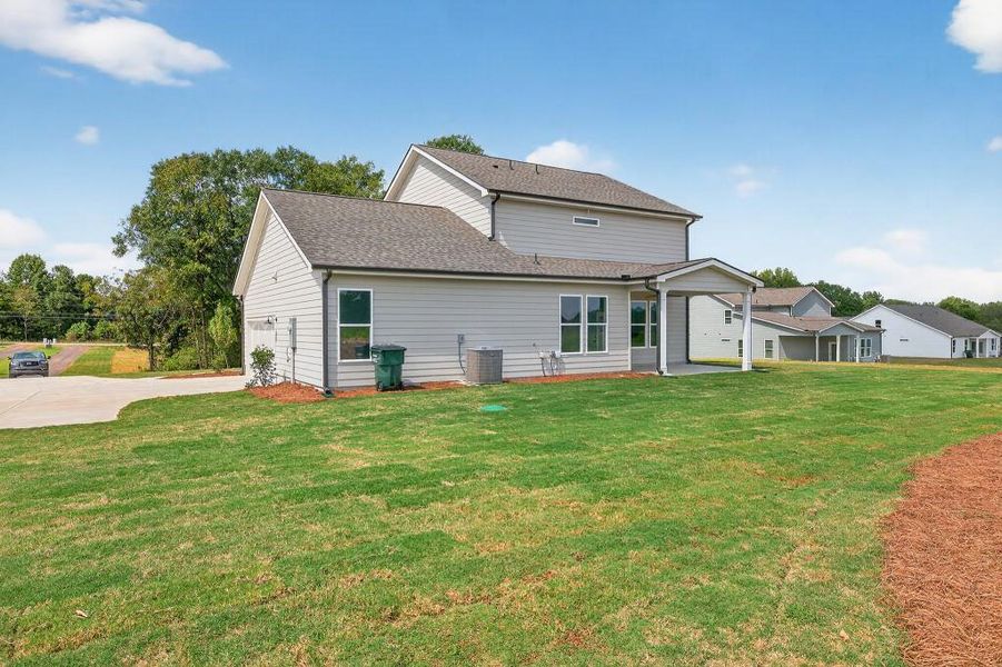Front exterior of a new home in Magnolia Ridge, Monroe, GA, highlighting curb appeal (Image 17).