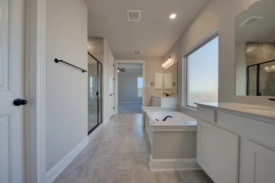 Representative furnished interior of a home built from the Barnett by Ashton Woods in Sunday Creek at Kinder Ranch, San Antonio (Image 10).