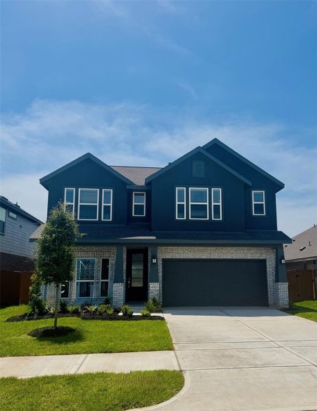 Front exterior of a new home in Windrose Green: Bristol Collection, Angleton, TX, highlighting curb appeal (Image 2). Front exterior of a new home in Windrose Green: Bristol Collection, Angleton, TX, highlighting curb appeal (Image 2).