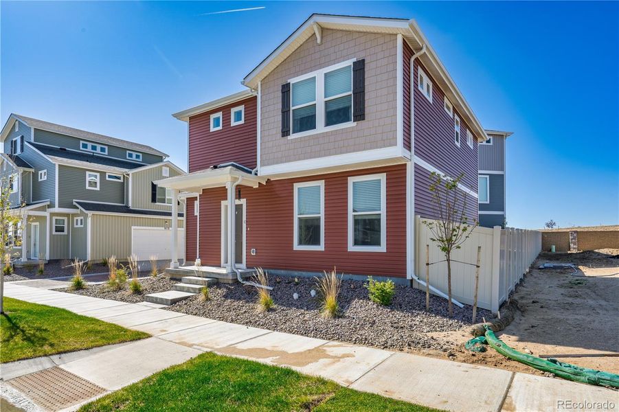 Front exterior of a new home in , Colorado Springs, CO, highlighting curb appeal (Image 2).