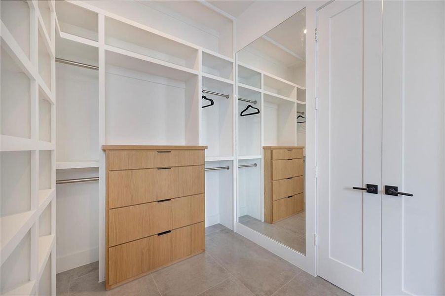 Spacious closet featuring light tile patterned floors