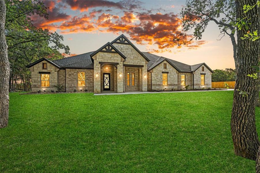 View of front of home featuring a yard