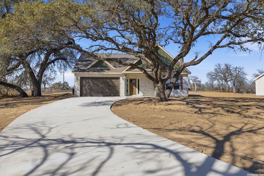 Front exterior of a new home in Lonesome Dove, San Antonio, TX, highlighting curb appeal (Image 21).