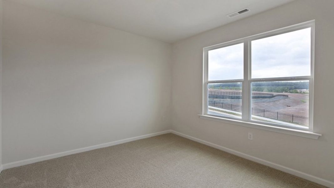 Spacious, unfurnished interior of a new home in The Grove at Matthews Landing, Fuquay Varina (Image 22).