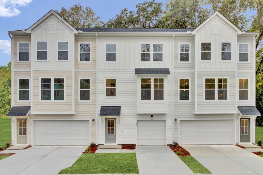 Front exterior of a new home in Indigo Grove Townhomes, Johns Island, SC, highlighting curb appeal (Image 1).