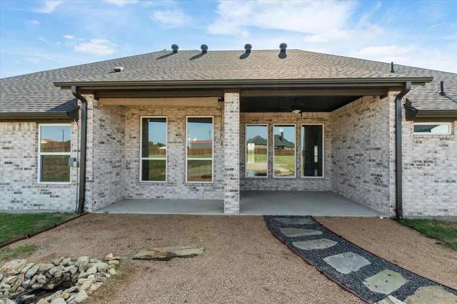 Front exterior of a new home in , Weatherford, TX, highlighting curb appeal (Image 20).