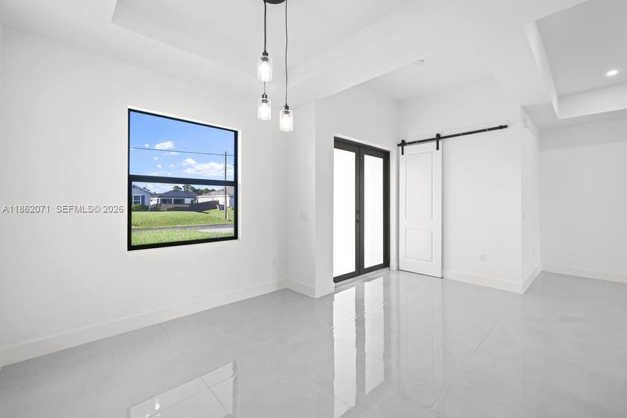 ENTRANCE AND BARN DOORS INTO LAUNDRY & GARAGE