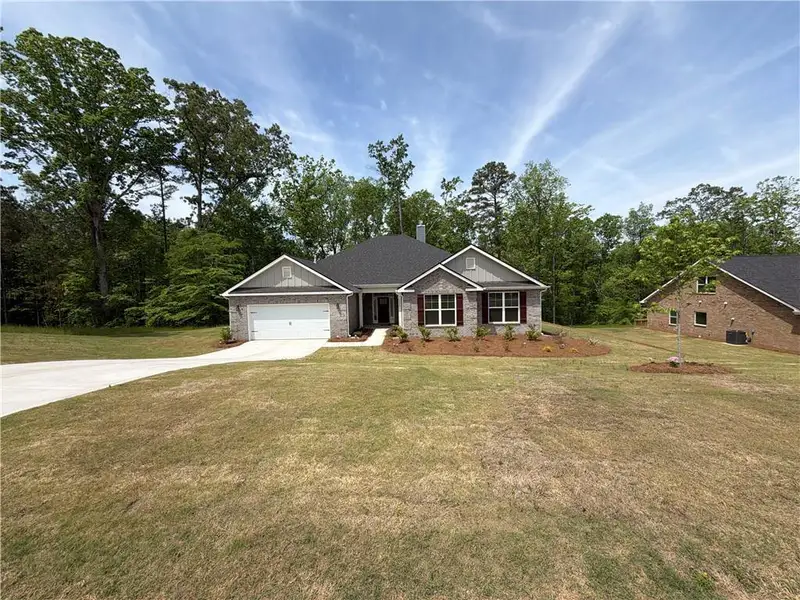 Front exterior of a new home in Tuscany Hills, Douglasville, GA, highlighting curb appeal (Image 1). Front exterior of a new home in Tuscany Hills, Douglasville, GA, highlighting curb appeal (Image 1).