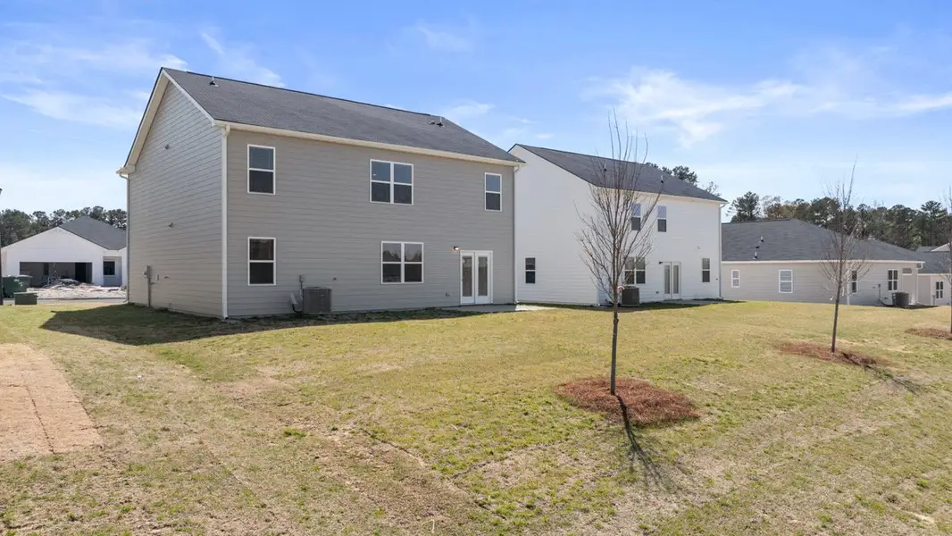 Exterior details and patio area of a home in Twin Lakes, Hoschton (Image 3).