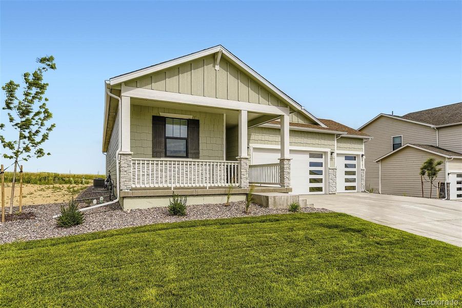 Front exterior of a new home in Spring Valley Ranch, Elizabeth, CO, highlighting curb appeal (Image 2). Front exterior of a new home in Spring Valley Ranch, Elizabeth, CO, highlighting curb appeal (Image 2).