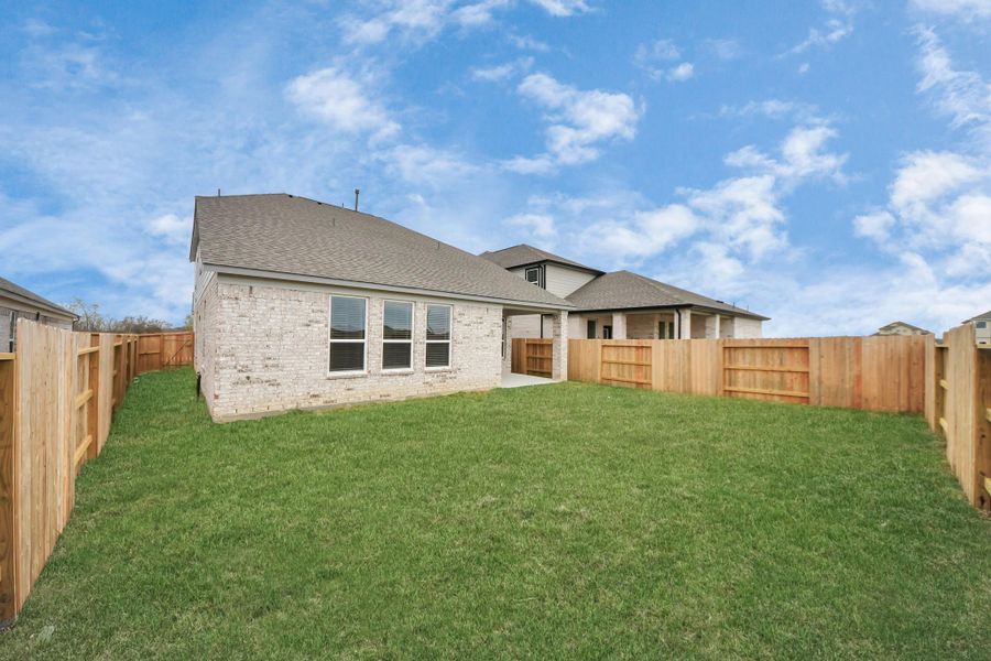 Come and see this spacious backyard with its beautiful covered patio. There is plenty ofroom for the kids to play and adults to relax. Perfect for your outdoor living space, patiofurniture, bbq pit, and so much more. The possibilities are endless!