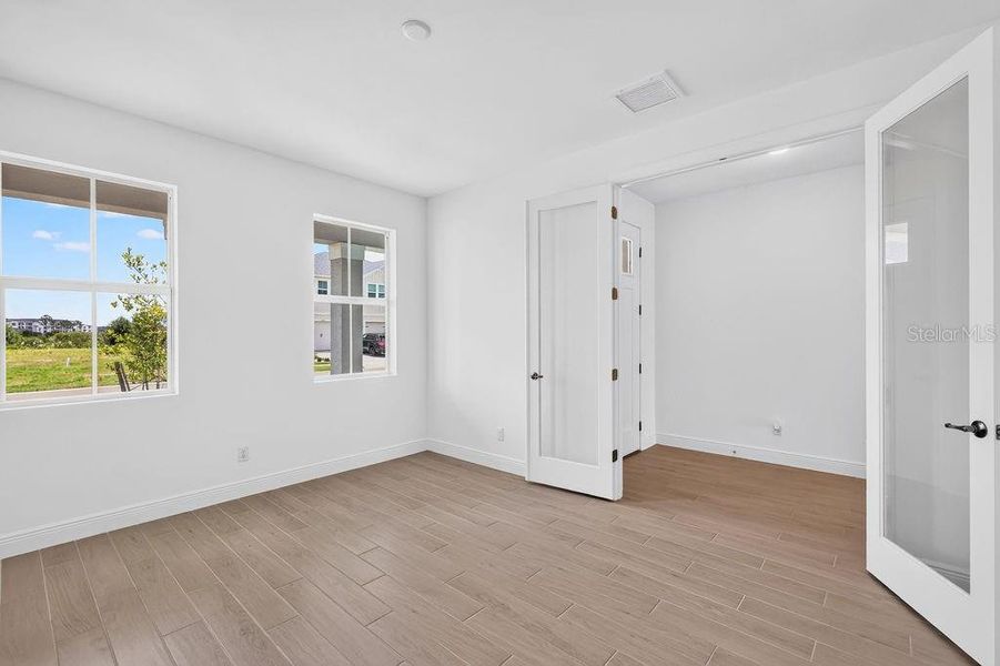Spacious, unfurnished interior of a new home in The Sanctuary – Royal Collection, Punta Gorda (Image 26). Spacious, unfurnished interior of a new home in The Sanctuary – Royal Collection, Punta Gorda (Image 26).