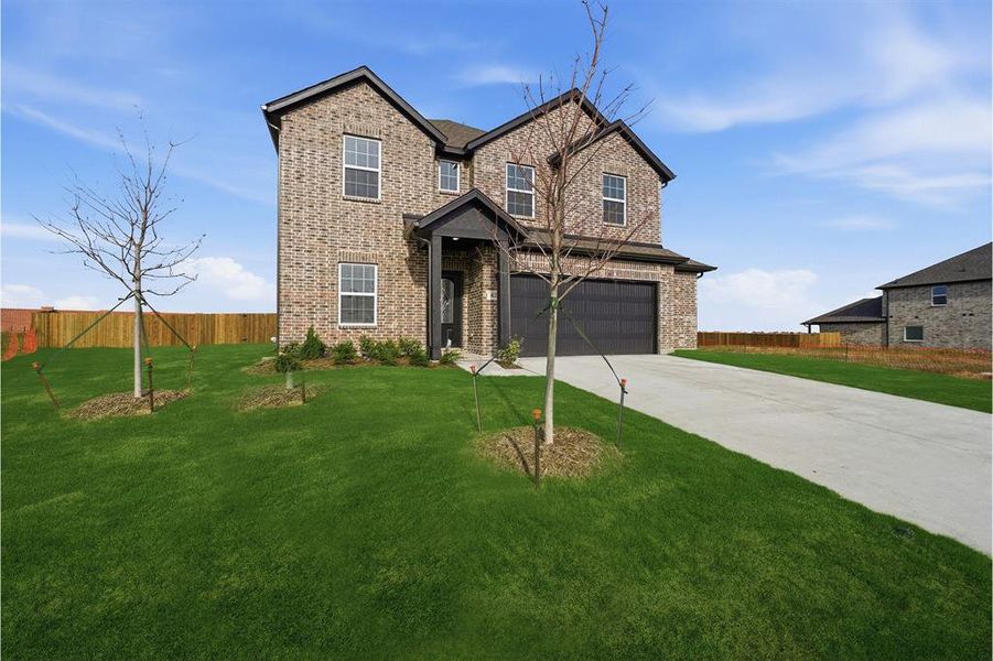 Front exterior of a new home in Saddlebrook Estates, Waxahachie, TX, highlighting curb appeal (Image 21). Front exterior of a new home in Saddlebrook Estates, Waxahachie, TX, highlighting curb appeal (Image 21).