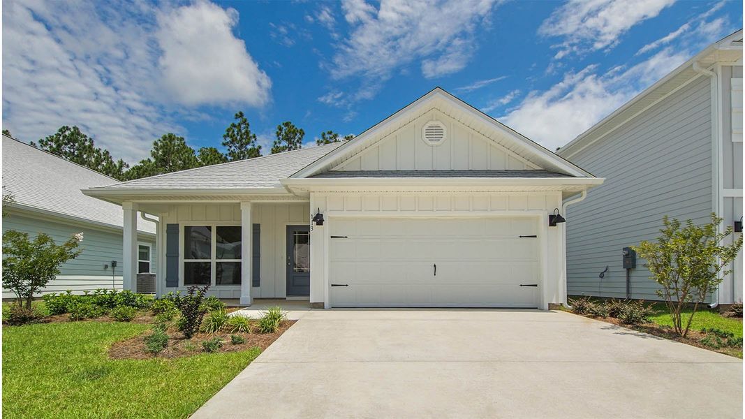 Front exterior of a new home in Bayside at Ward Creek, Panama City Beach, FL, highlighting curb appeal (Image 2). Front exterior of a new home in Bayside at Ward Creek, Panama City Beach, FL, highlighting curb appeal (Image 2).