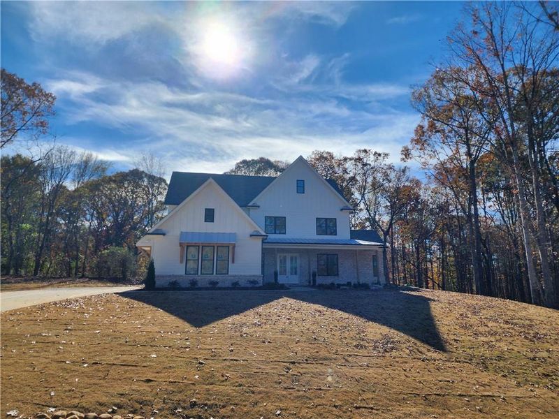 Front exterior of a new home in , Pendergrass, GA, highlighting curb appeal (Image 1).