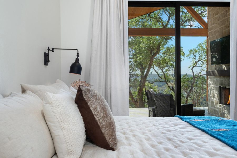 This is a TO BE BUILT custom home on 6.75 acres in Rainbow Ranch, Wimberley TX.