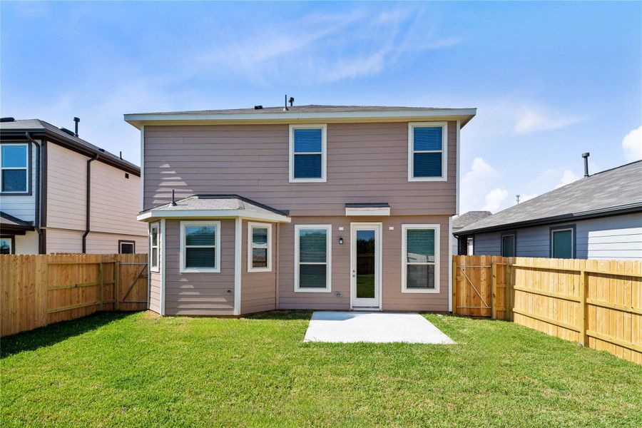 Come explore this expansive backyard featuring a spacious patio slab—perfect for outdoor living! There's ample space for kids to play and adults to unwind. Ideal for patio furniture, a BBQ pit, and so much more—the possibilities are endless!