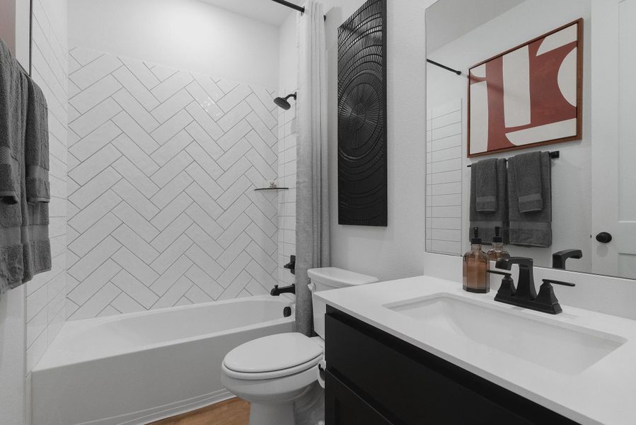 Representative furnished interior of a home built from the Brooks by Chesmar Homes in University Heights, McKinney (Image 17).
