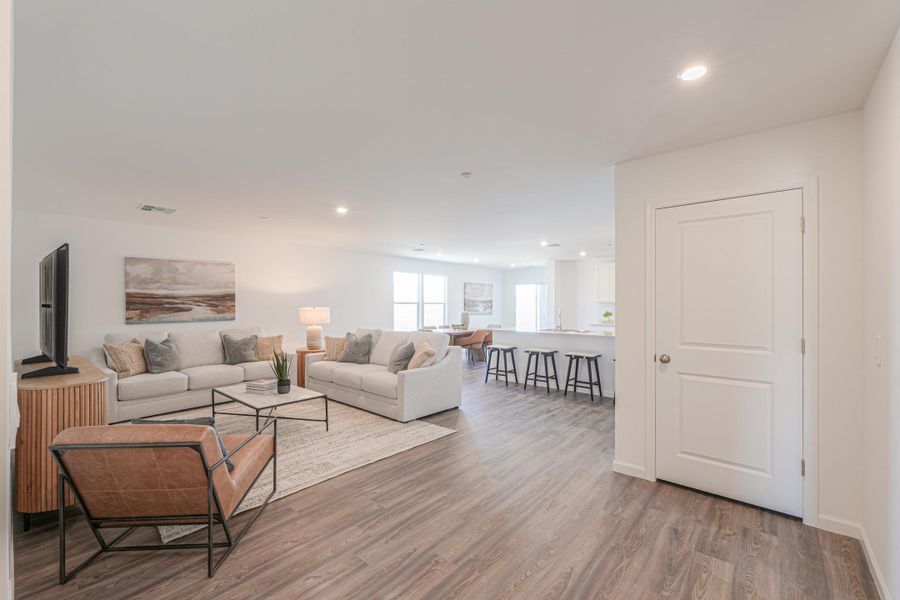 A living room with a wood floor. A living room with a wood floor.