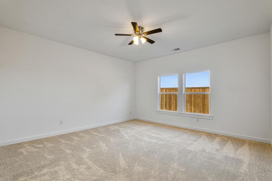 Carpeted Master Bedroom with ceiling fan Carpeted Master Bedroom with ceiling fan