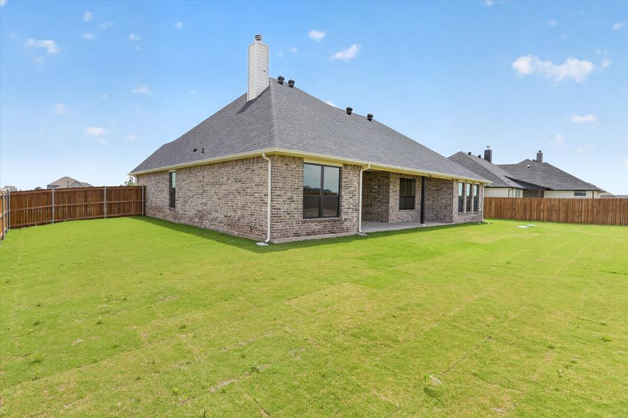 Front exterior of a new home in Coyote Crossing, Godley, TX, highlighting curb appeal (Image 28).