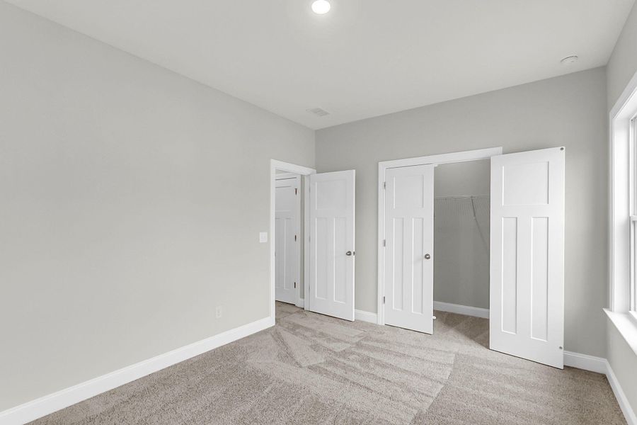 Spacious, unfurnished interior of a new home in Tidewater at Lakes of Cane Bay, Summerville (Image 46).
