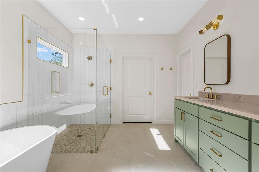 Bathroom with a soaking tub, vanity, a stall shower, light tile patterned floors, and recessed lighting Bathroom with a soaking tub, vanity, a stall shower, light tile patterned floors, and recessed lighting