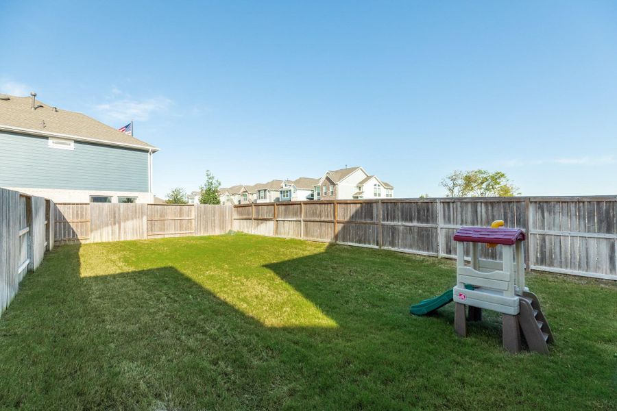 This view of the backyard demonstrates the depth of the lot.