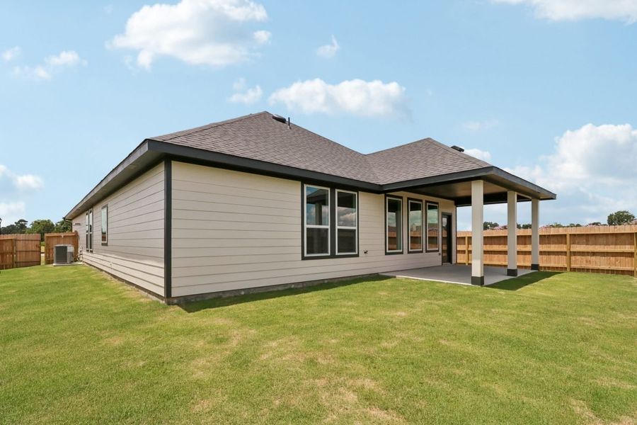 Exterior details and patio area of a home in Trinity Grove, Spring (Image 18).