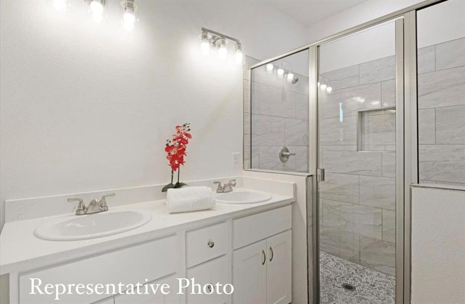 Bathroom with vanity and an enclosed shower