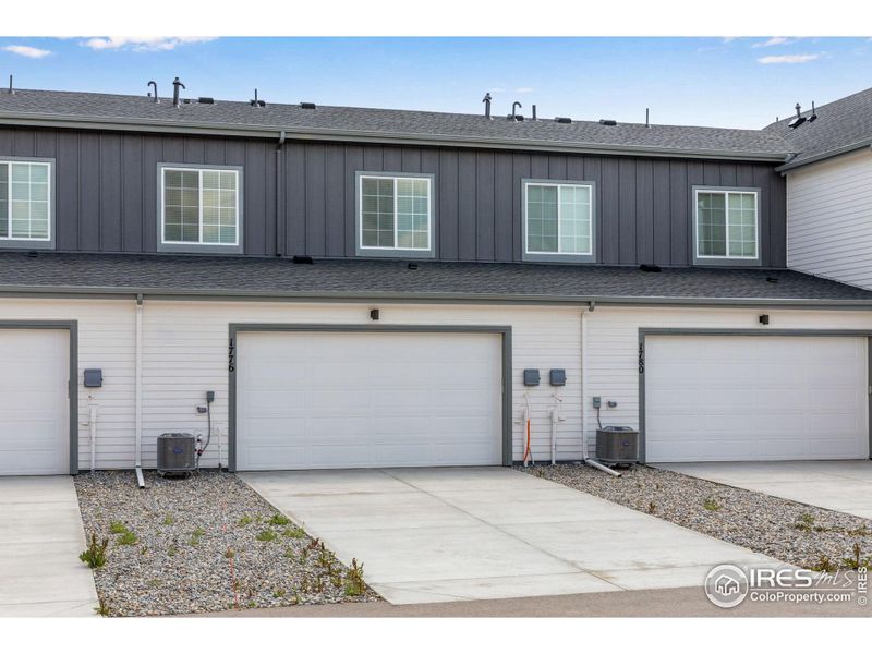 Exterior details and patio area of a home in Westside Crossing Townhomes, Berthoud (Image 3).