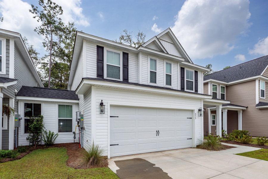 Front exterior of a new home in Hampton Woods, Summerville, SC, highlighting curb appeal (Image 22). Front exterior of a new home in Hampton Woods, Summerville, SC, highlighting curb appeal (Image 22).