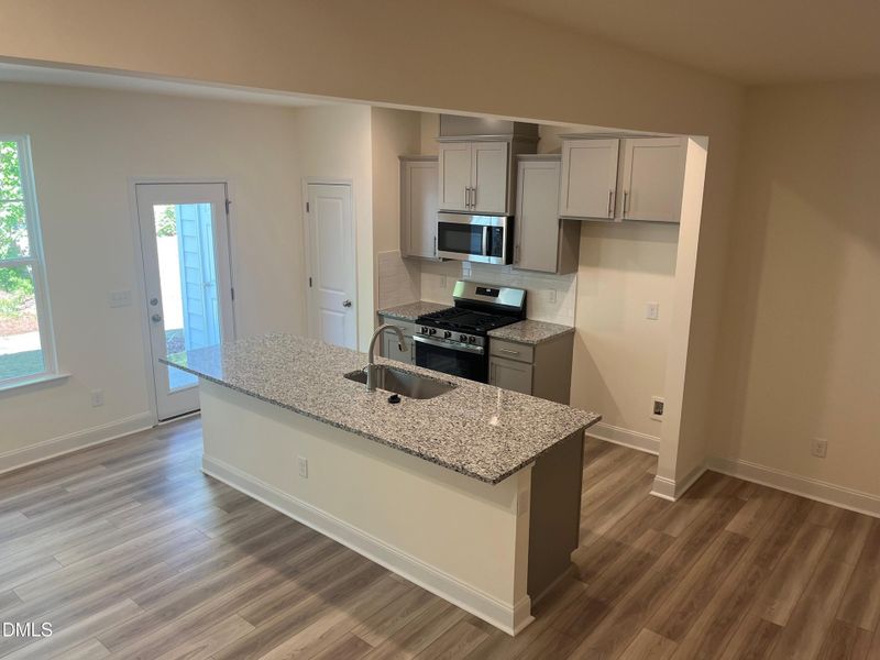 Kitchen leading to back patio