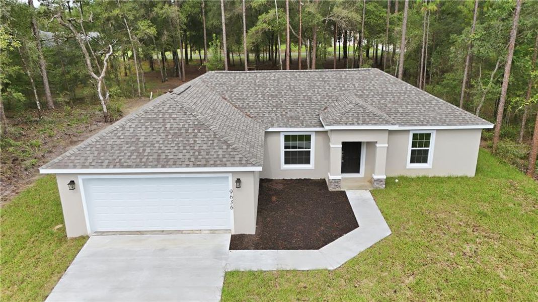 Front exterior of a new home in , Citrus Springs, FL, highlighting curb appeal (Image 19).