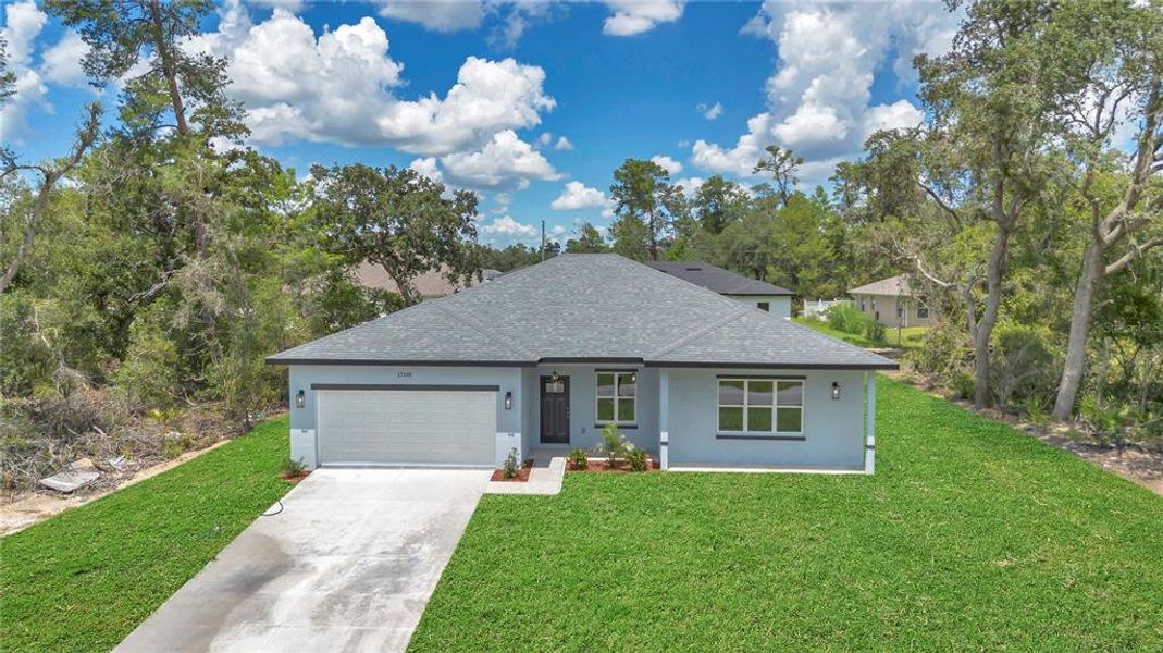 Front exterior of a new home in , Ocala, FL, highlighting curb appeal (Image 28).