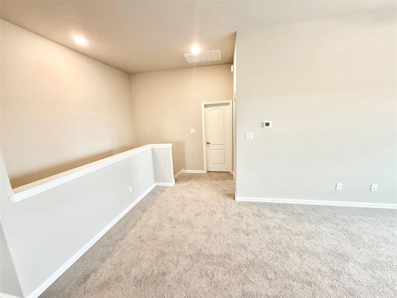 Unfurnished room featuring light carpet and recessed lighting Unfurnished room featuring light carpet and recessed lighting