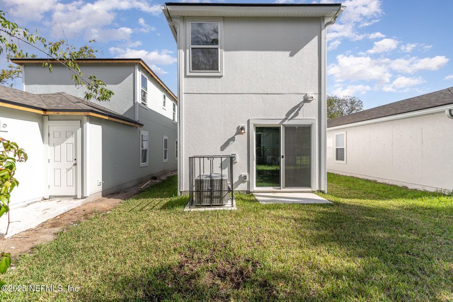 Front exterior of a new home in , Jacksonville, FL, highlighting curb appeal (Image 2).