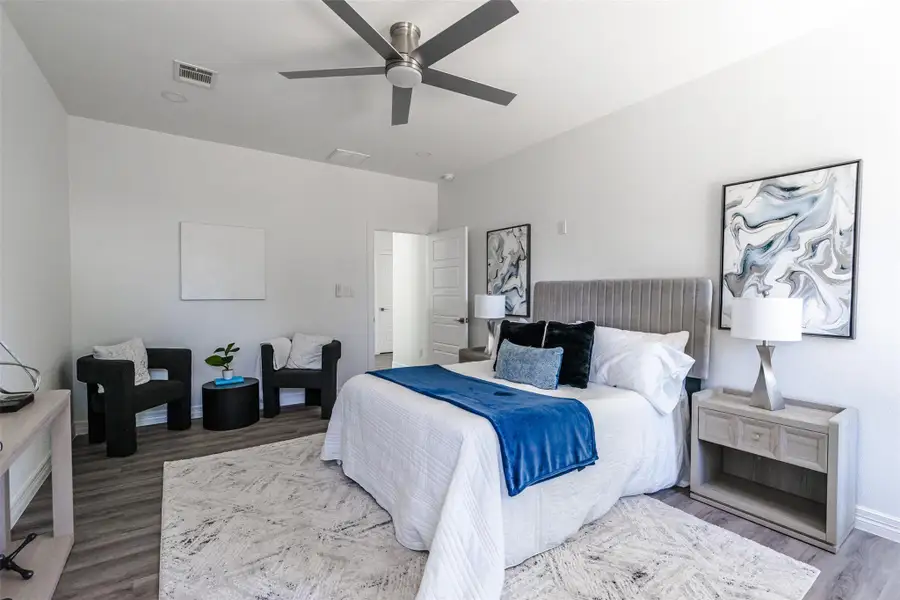 Bedroom featuring wood finished floors and a ceiling fan
