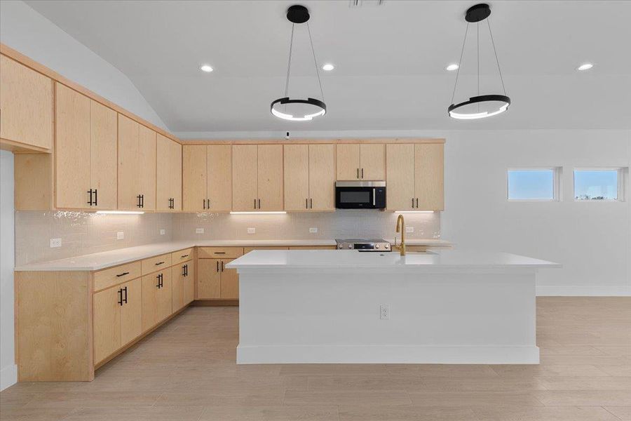 Kitchen with light brown cabinetry, tasteful backsplash, appliances with stainless steel finishes, hanging light fixtures, and recessed lighting Kitchen with light brown cabinetry, tasteful backsplash, appliances with stainless steel finishes, hanging light fixtures, and recessed lighting