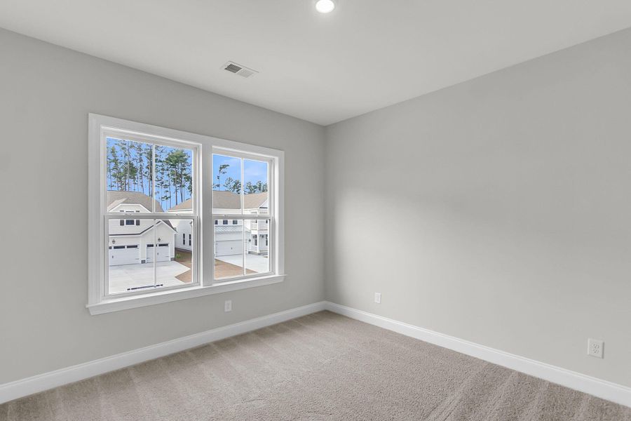 Spacious, unfurnished interior of a new home in Tidewater at Lakes of Cane Bay, Summerville (Image 45).