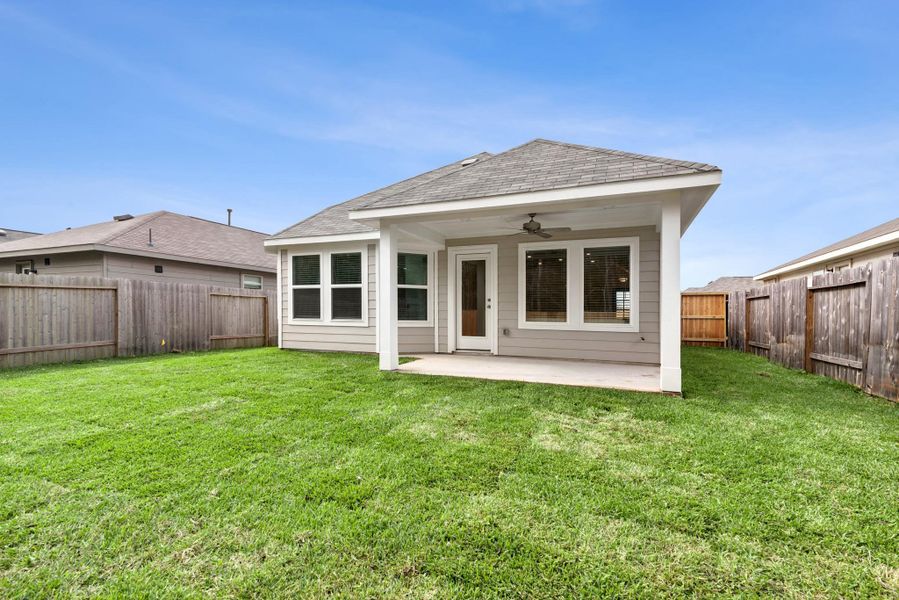 Exterior details and patio area of a home in Magnolia Ridge, Magnolia (Image 20).