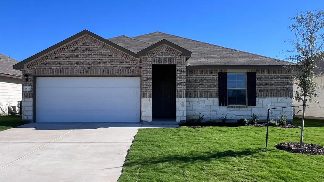 Front exterior of a new home in Pecan Creek, Temple, TX, highlighting curb appeal (Image 1).