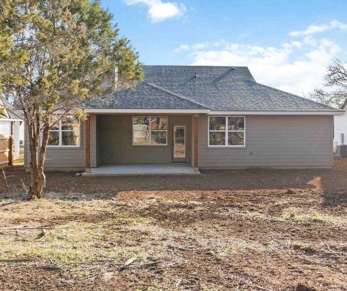 Back of home without green color added to the grass