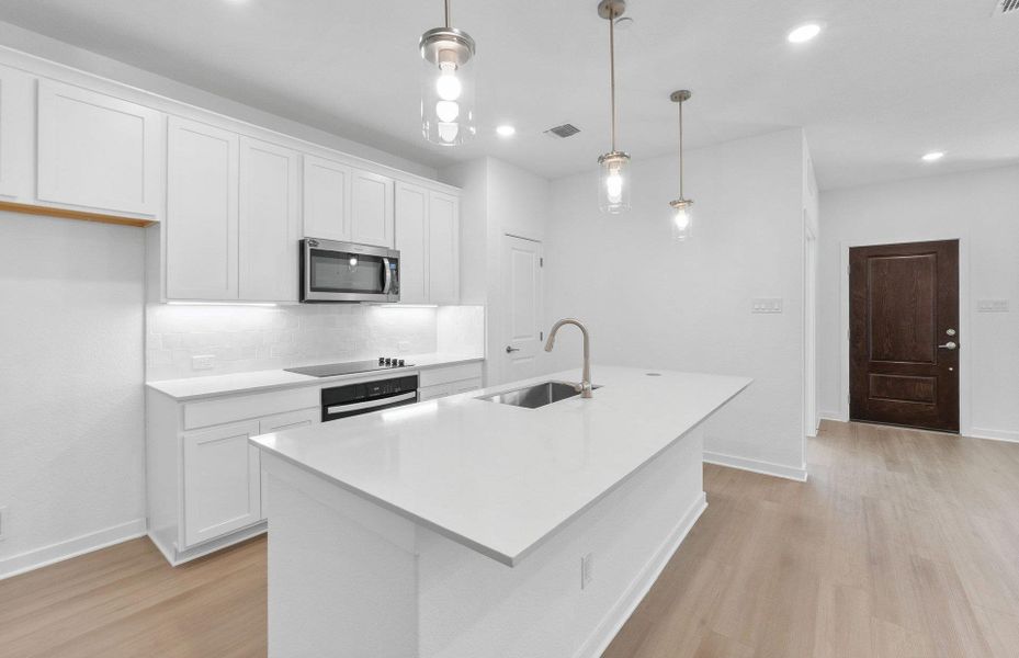 Furnished interior view inside a new home in Monarch on Main, Round Rock (Image 6).
