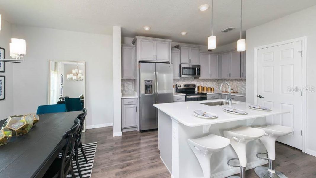 Furnished interior view inside a new home in Esplanade at Coasterra, Palmetto (Image 9). Furnished interior view inside a new home in Esplanade at Coasterra, Palmetto (Image 9).